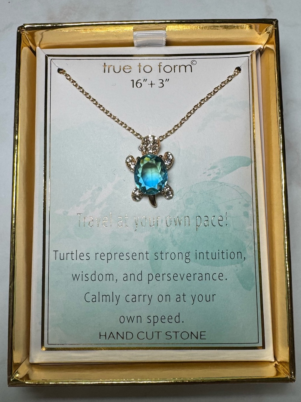 Gold Turtle Necklace with Blue Gem